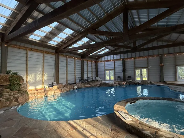 The indoor pool and its hot tub
