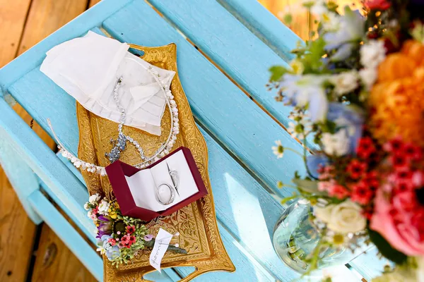 Shoes, rings, and the bouquet before the ceremony